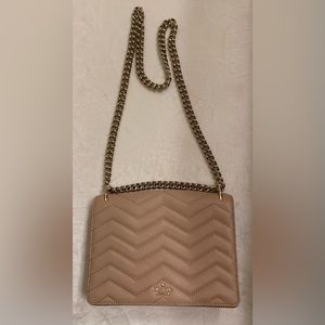 New with out tag Kate Spade quilted flap leather purse. Never been used.